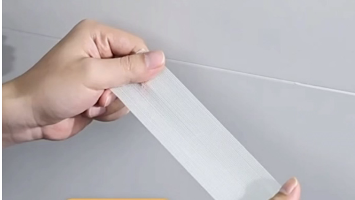 Fita dupla face à base de malha transparente